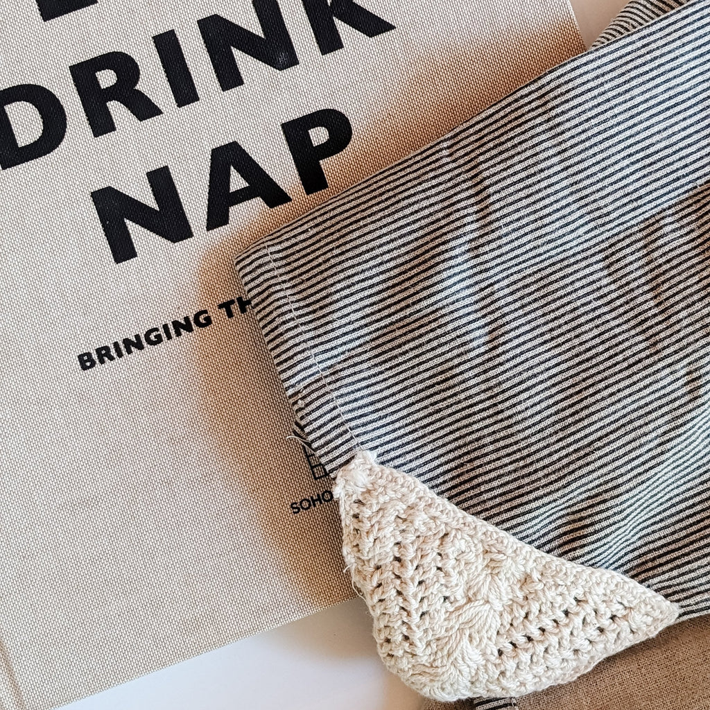 Black and white stripe kitchen towel with crochet details.