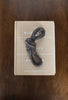 knot figurine on book